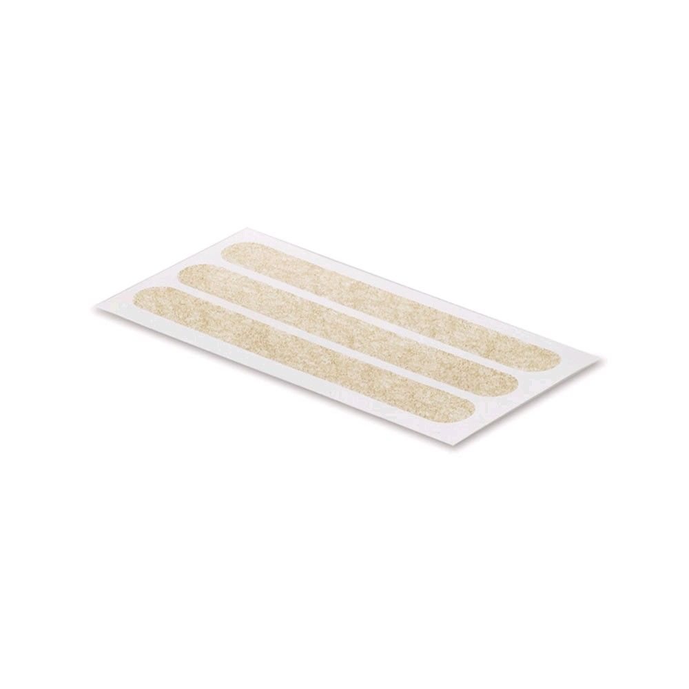 Wundnahtstreifen auf Trägerfolie, drei beige Pflasterstreifen
