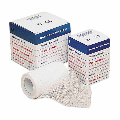 Haft-Mullbinde YPSIFLEX® haftend: hellgraue Mullbinde auf Rolle, abgewickelt, Packung