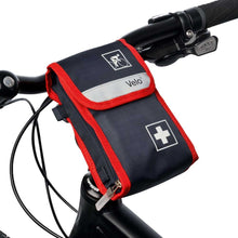 Befüllte Fahrradverbandtasche VELO® am Lenker, dunkelblau mit rotem Rand und weißem Plus