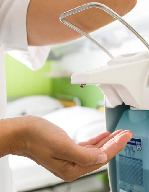 Hand sanitizer being applied in an office